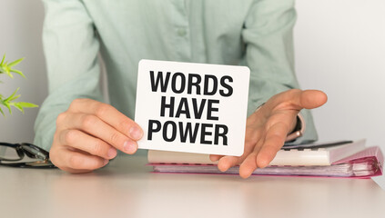 Words Have Power message on the card shown by a woman, Business Concept.