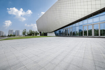 Empty brick floor and modern city buildings background