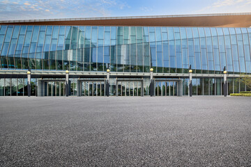 Empty asphalt road and office buildings in modern city