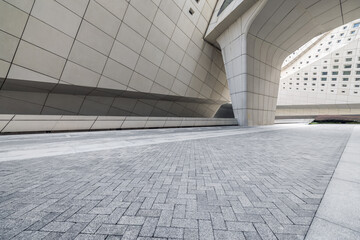 Empty brick floor passage and buildings in modern city