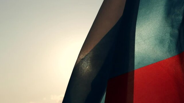 Russia Flag, Happy National Holidays, Victory Day, Orthodox. Russia flag waving against the wind, beautiful sunset sky clouds outdoor backgrounds, Slow motion. Concept of Russia, Ukraine, War.