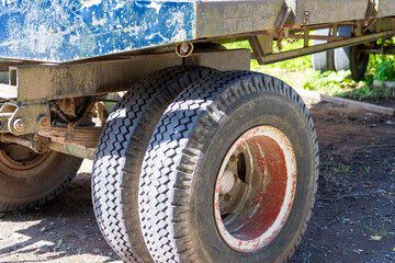 Close-up of old trailer for tree trunks in the forest