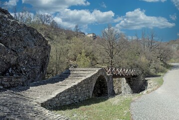  A stone one-arched bridge at Paraspori location, just before arriving in the village above Alonitikos Lakkos, a stream that flows into Sarantaporos river, Chioniades, NW Greece