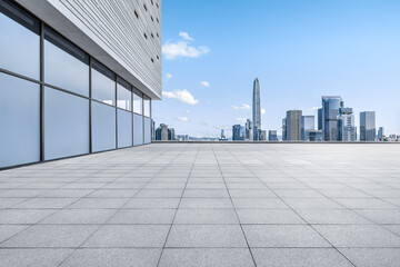 Fototapeta premium Empty floor square and cityscape with skyline in modern city
