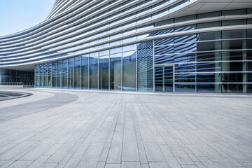 Empty brick floor and modern city buildings background