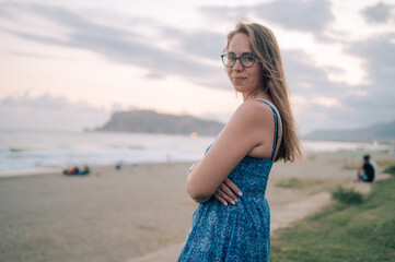 Woman on the beach and looks at the sea in Alanya city, Turkey. Travelling or vacation concept