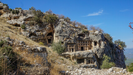 Panorama of the rock tombs of the Ancient Necropolis of the ancient city of Tlos, Turkey.