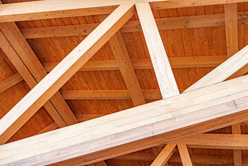 Construction of a wooden roof of a frame house.