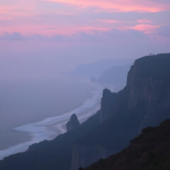 Sunset over a mountain near the sea.