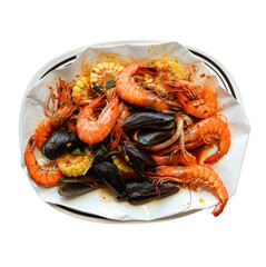 A vibrant seafood platter featuring shrimp, mussels, and corn, beautifully arranged on a circular dish.