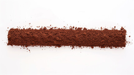 A brown powdery substance is spread out on a white background. The substance appears to be a type of spice or seasoning, and it is spread out in a long, thin line. The image has a somewhat messy