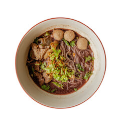 A bowl of noodles topped with meat, meatballs, and fresh herbs in a rich broth.