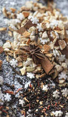 top view on heap of winter hot drink ingredient spilled on table with anise star