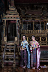 women in traditional clothing  on Buddhist on background.  Portrait women in traditional clothing , Thai traditional  in Ayutthaya, Thailand.