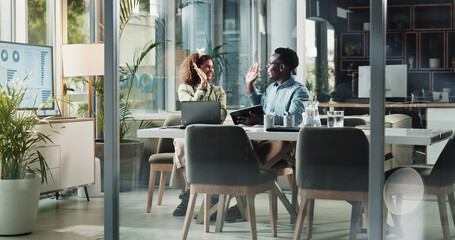 Business woman, man and high five in office for b2b deal, agreement and goals with tablet at startup. People, partner and celebration for performance, profit and cheers with laptop at finance agency
