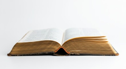 Open vintage book with yellowed pages on white background