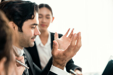 Diverse of business people from various ethnic group working in modern office environment. Productive and multi ethnic office workers engage in discussion for strategic business marketing. Habiliment