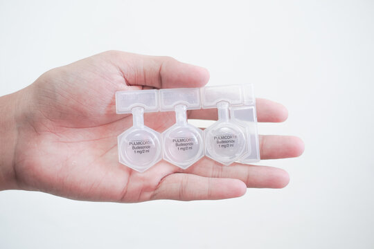 Balikpapan, November 11, 2024. Holding a bottle of Budesonide Budecort Respules Nebulizing Suspension. Budesonide sterile single dose units, used for bronchial asthma