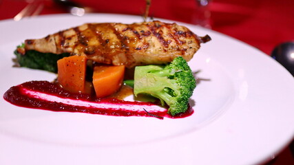Grilled Tuna served with carrots, potatoes, broccoli with red sauce