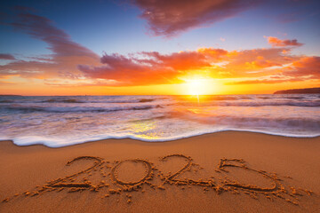 Happy New Year 2025 nature background, tropical beach shore and beautiful sunrise over the sea...