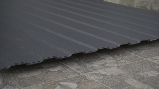 folding sheets of metal profile, roofing sheets stacking in a pile in a warehouse