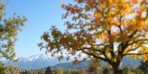 A blurred garden tree in a stunning park landscape with a majestic mountain range and clear blue sky, mountain, garden