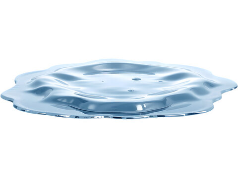 Close-up of a puddle of clear liquid, reflecting light.