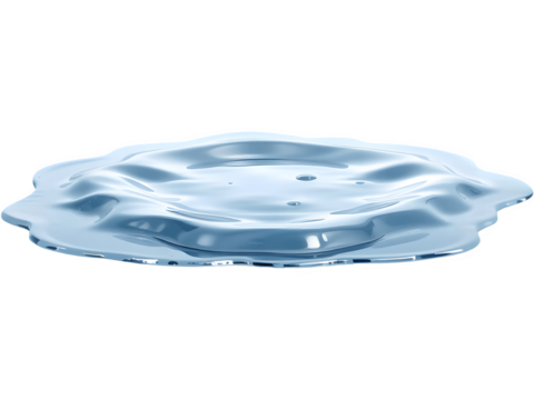 Close-up of a puddle of clear liquid, reflecting light.