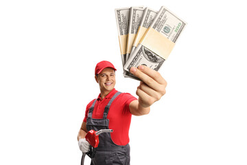 Petrol station worker holding a refueling gun and money