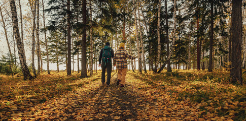 Fototapeta premium couple walking in autumn forest