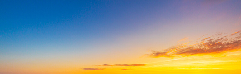 Morning cloud and sky background,Panorama sunset sky and cloud background,Real majestic sunrise sundown sky background with gentle colorful clouds without birds. Panoramic, big size