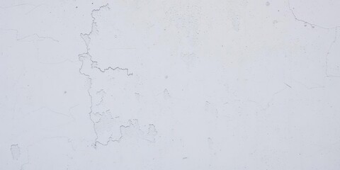 Obraz premium Distressed white cement wall texture with visible aggregate, gritty surface, raw material