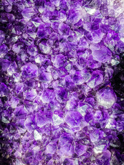 Amethyst purple crystals. Mineral crystals in geode. Gemstones amethyst bright lilac, texture of stone