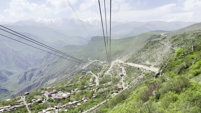 Airview from cable car in the longest ropeway cabin Wings of Tatev between Halidzor and Tatev monastery on canyon in spring time. Up the hill in nature park