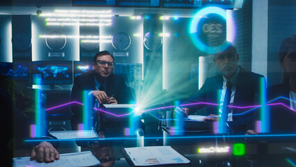 Business Professionals in a Meeting Room Analyze Financial Data Holograph Projected on Screen. Diverse Team Collaborates on Strategic Planning Using Digital Analytics, Charts, Graphis, Growth Visuals