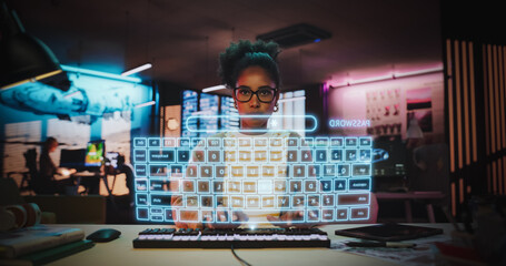 Stylish Female Programmer Logs Into a Holographic Computer Screen in Office, Using Advanced Facial Recognition, Virtual Keyboard Technology for Cyber Secure Digital Interaction. Future Interface