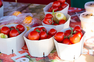 Small boxes with fruits in self-service farm shop. Homemade food store without salespeople.