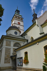 Cathedral of the Nativity of the Blessed Virgin Mary in Żywiec – a temple built in the fifteenth century with a high tower with a clock on it © Pawel Filusz