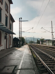 A train station with a train on the tracks