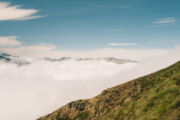 Fototapeta premium A breathtaking view of lush green hills unfolds, capturing the serenity of the French Pyrenees