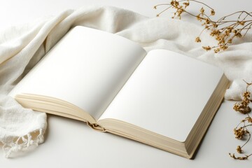 Fototapeta premium Open book with blank pages placed on fabric