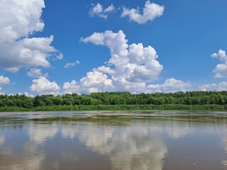 Fototapeta premium clouds over the river