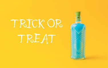 Bottle of blue liquid with a label that says Trick or Treat