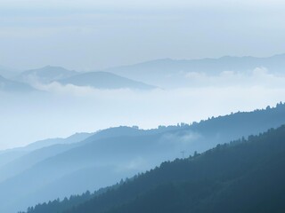Naklejka premium Foggy mountain range with misty valleys, misty landscape, rugged terrain