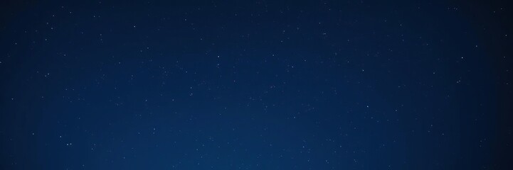 Fototapeta premium Soft focus image of a vast dark blue night sky with stars, celestial, blue