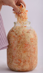 three-liter glass jar with pickled white cabbage