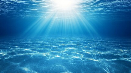 Sunlight pierces through crystal-clear ocean waters, creating a mesmerizing dance of light beams on the sandy seabed, evoking tranquility and wonder.