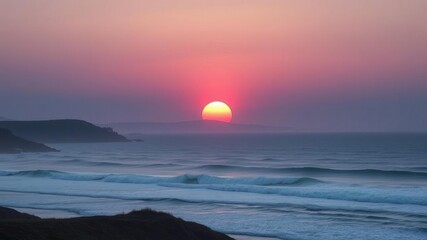 Naklejka premium The sun rises slowly over the rolling hills and waves of the ocean at morning break, natural beauty, soft focus, ocean horizon