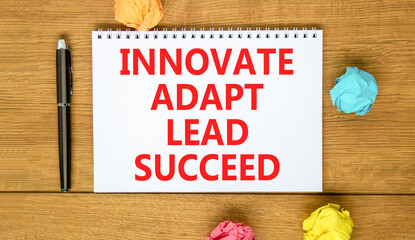 Innovate adapt lead succeed symbol. Concept words Innovate Adapt Lead Succeed on beautiful note....