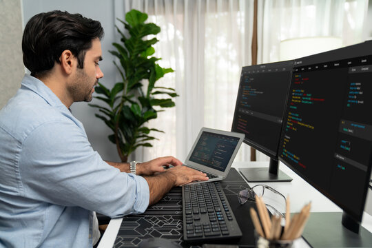Smart IT developer working software development coding on laptop, creating application program update version online website on data's system two computer code pc screen at modern office. Surmise.